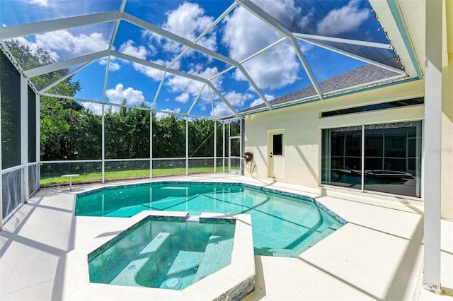 view of swimming pool with a lanai, an in ground hot tub, and a patio area