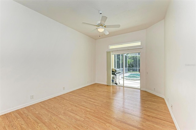 spare room featuring ceiling fan and light hardwood / wood-style flooring