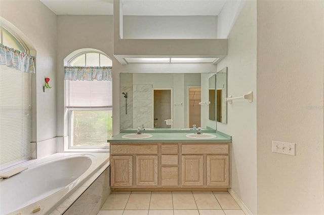 bathroom featuring vanity, tile patterned floors, and separate shower and tub