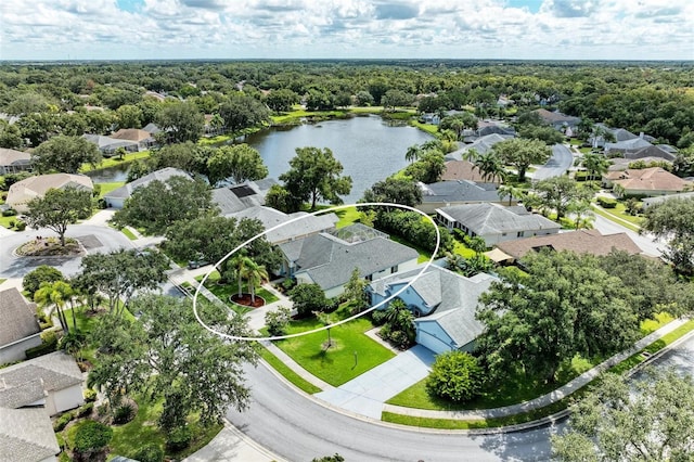 birds eye view of property with a water view