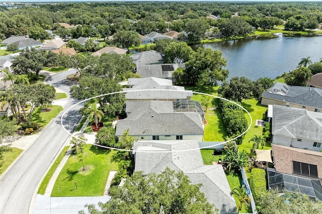 birds eye view of property with a water view