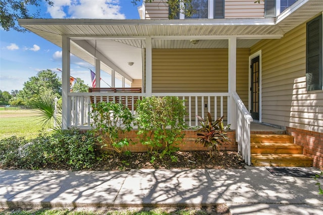 doorway to property featuring covered porch