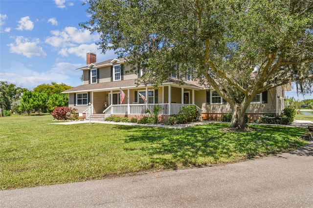 view of front facade featuring a front lawn and a porch