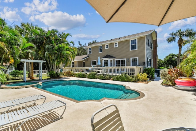 view of pool featuring an in ground hot tub and a patio area