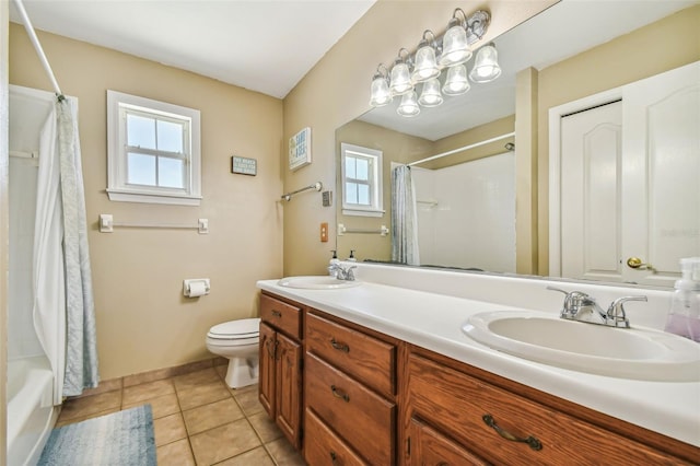 full bathroom with toilet, shower / bath combo, double sink vanity, and tile patterned floors