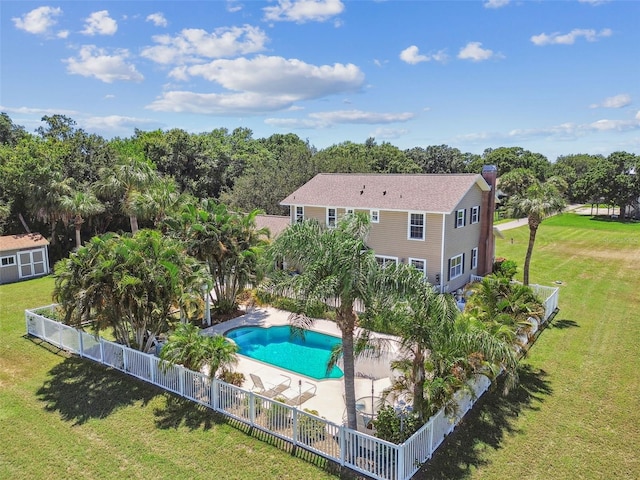 view of pool featuring a lawn and a patio area