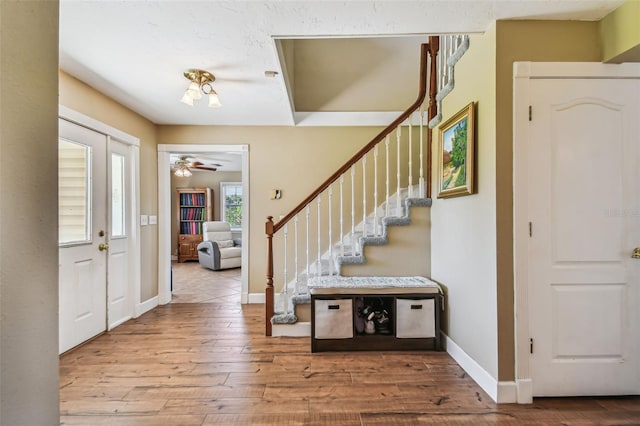 entryway with ceiling fan and hardwood / wood-style floors