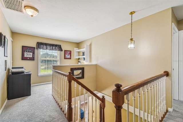 hallway with light carpet