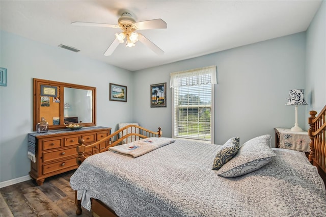 bedroom featuring ceiling fan and dark hardwood / wood-style flooring