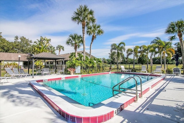 view of swimming pool featuring a gazebo and a patio