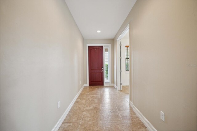 doorway to outside with light tile patterned floors