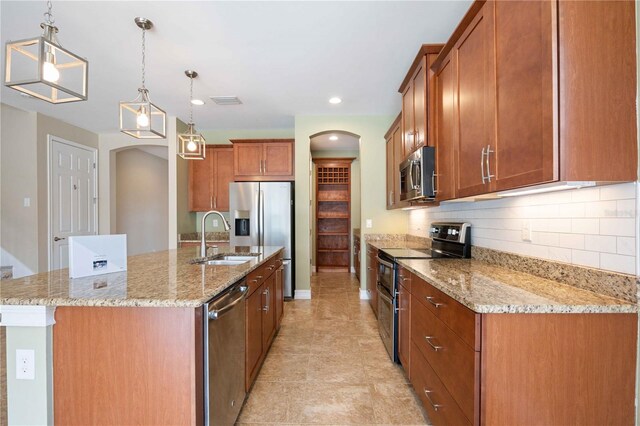 kitchen featuring appliances with stainless steel finishes, hanging light fixtures, backsplash, light tile patterned floors, and sink