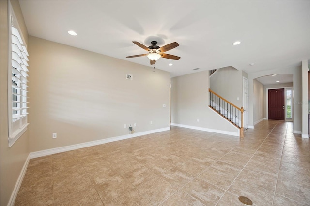 spare room with light tile patterned flooring and ceiling fan