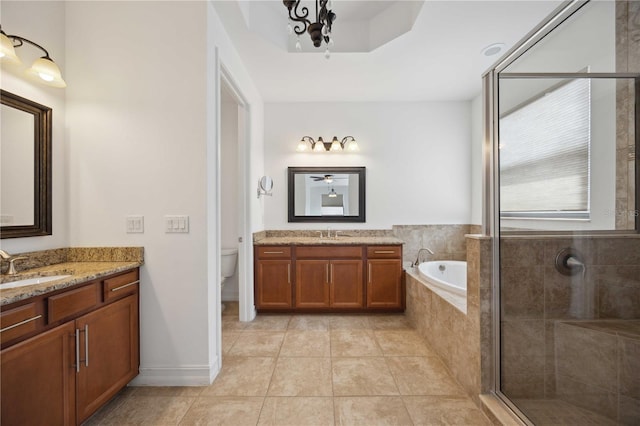 full bathroom featuring shower with separate bathtub, toilet, vanity, and tile patterned flooring