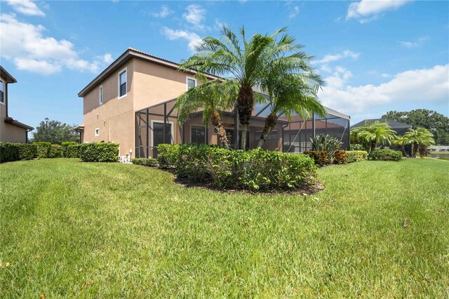 view of yard featuring a lanai