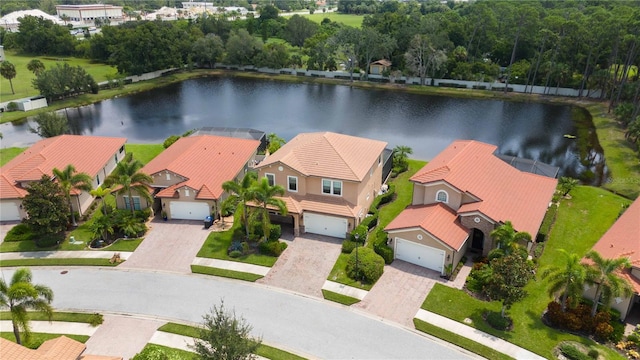 birds eye view of property with a water view