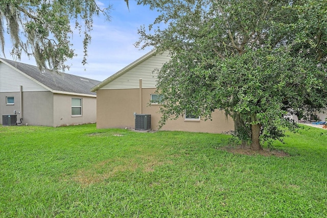 view of yard with central AC