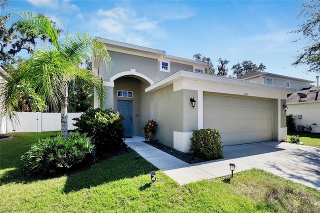 view of front of home featuring a garage and a front lawn