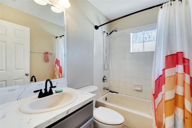 full bathroom featuring toilet, vanity, and shower / bath combination with curtain