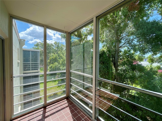 unfurnished sunroom featuring plenty of natural light