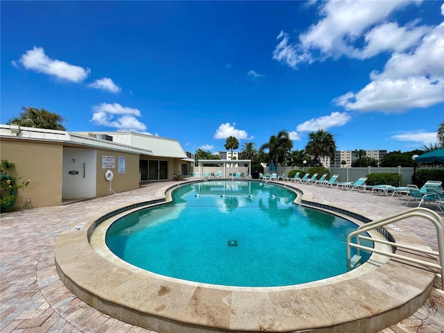 view of swimming pool featuring a patio area