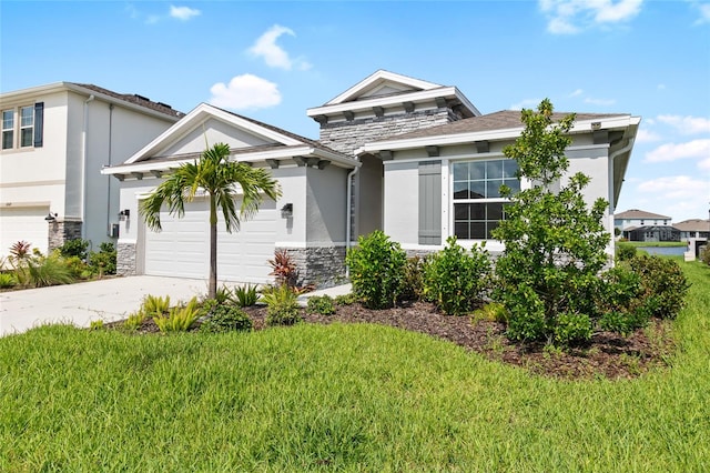 view of front of house with a garage and a front lawn