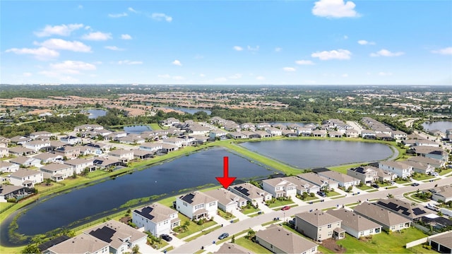 bird's eye view with a water view and a residential view