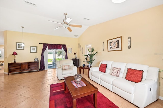 living room featuring lofted ceiling, light tile patterned flooring, and ceiling fan