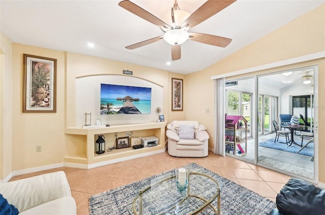 living room featuring built in features, light tile patterned floors, vaulted ceiling, and ceiling fan