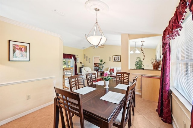 dining area with light tile patterned floors and lofted ceiling