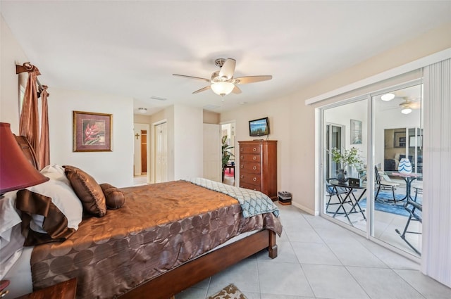 tiled bedroom with ceiling fan and access to exterior