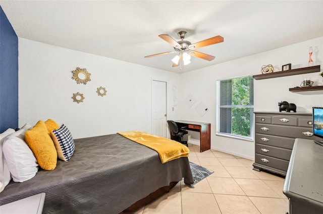 tiled bedroom with ceiling fan