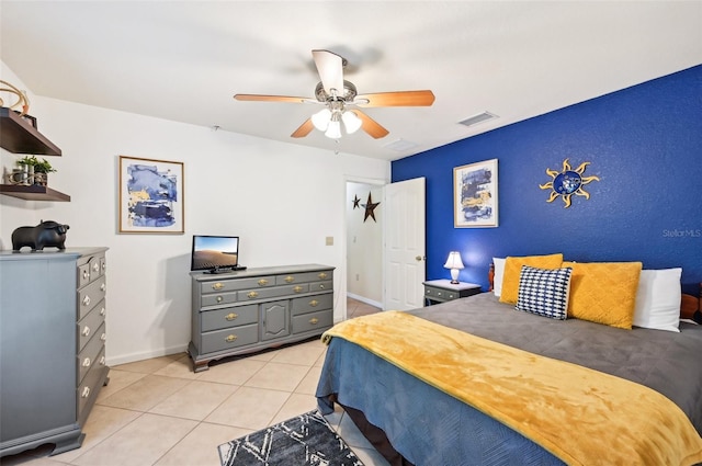 tiled bedroom with ceiling fan