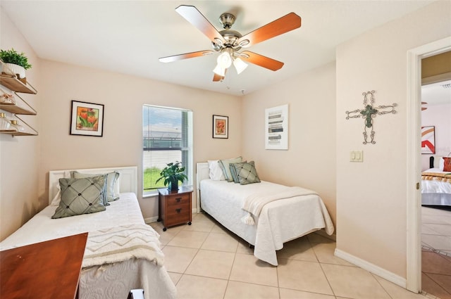 bedroom with light tile patterned flooring and ceiling fan