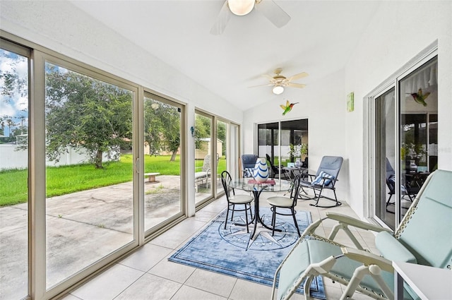 sunroom with ceiling fan and lofted ceiling