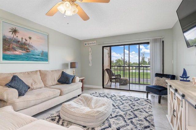 tiled living room featuring ceiling fan