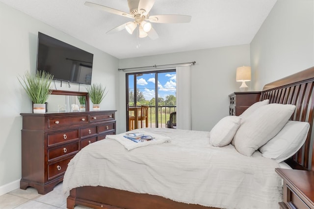 bedroom with ceiling fan, light tile patterned floors, and access to outside