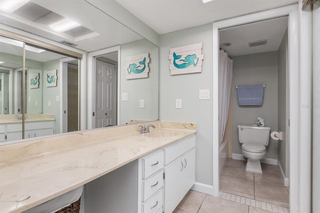 full bathroom featuring shower / bath combination with curtain, tile patterned floors, toilet, and vanity