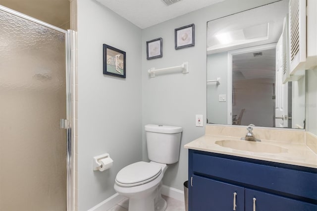 bathroom featuring vanity, toilet, a shower with door, and a textured ceiling