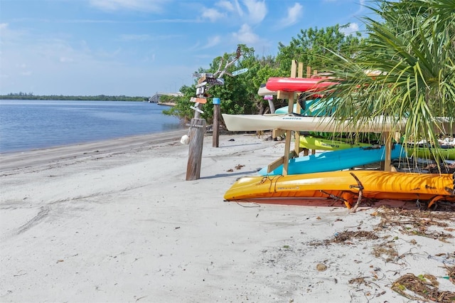 exterior space with a water view and a view of the beach