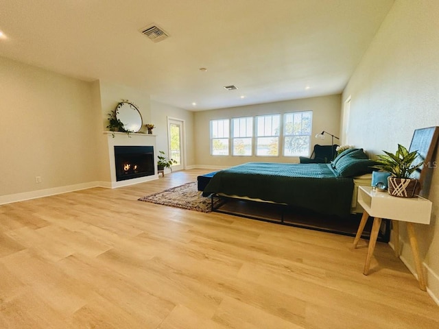 bedroom with light hardwood / wood-style floors