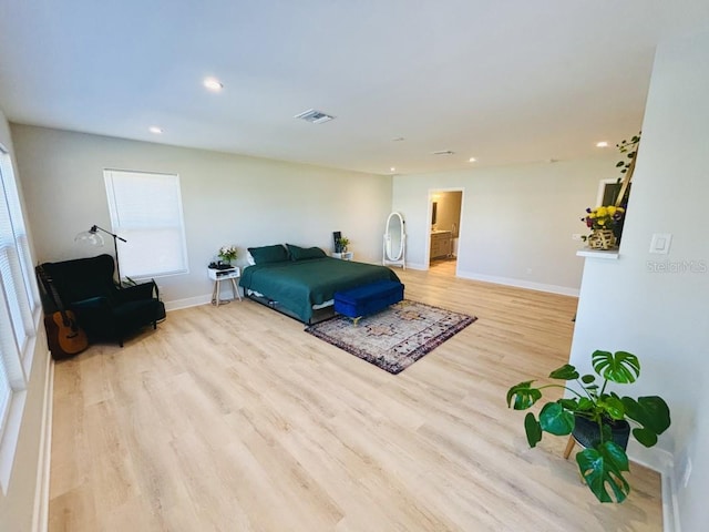 bedroom with light hardwood / wood-style floors