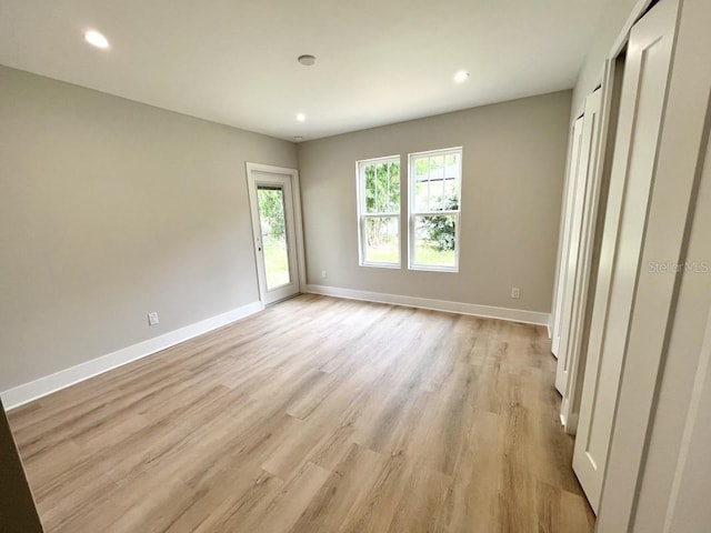 unfurnished bedroom with light hardwood / wood-style floors