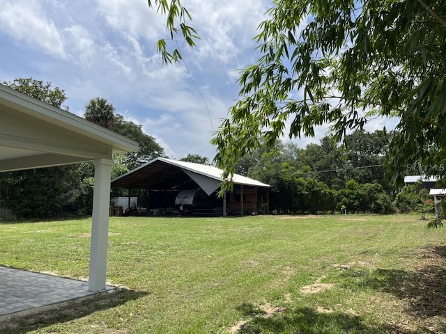 view of yard with a carport