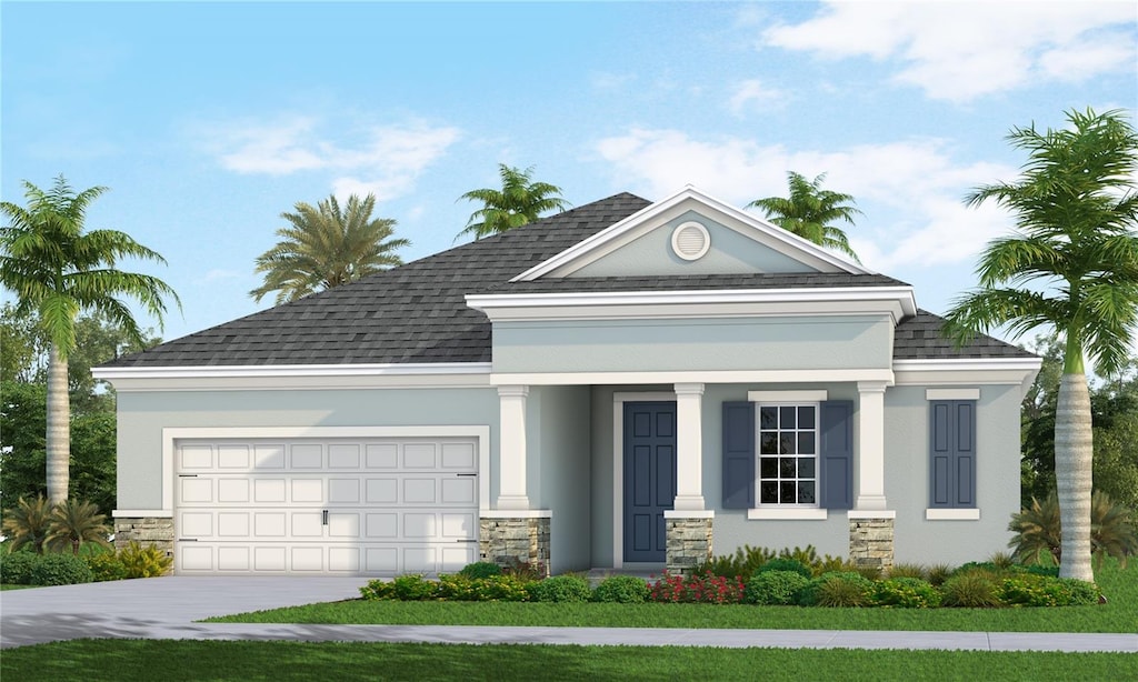 view of front facade with a garage and a front yard