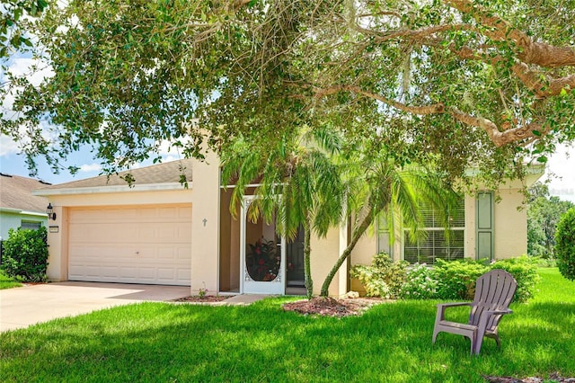 9861 50th Street Cir E, Parrish, FL 34219 - view of front of home featuring an attached garage, concrete driveway, stucco siding, and a front yard