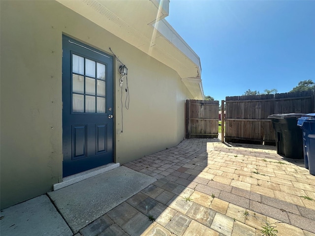 entrance to property featuring a patio area