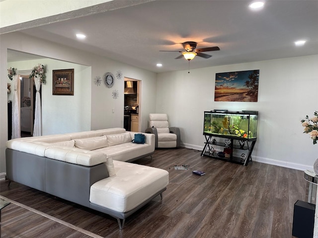 living room with ceiling fan and hardwood / wood-style floors