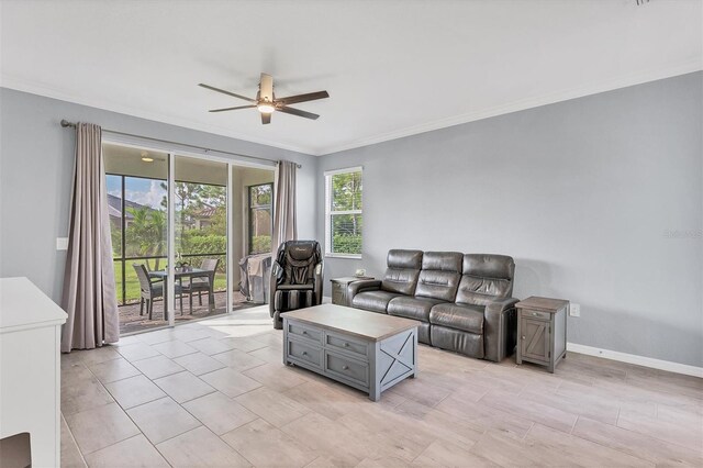 living room featuring ceiling fan and crown molding