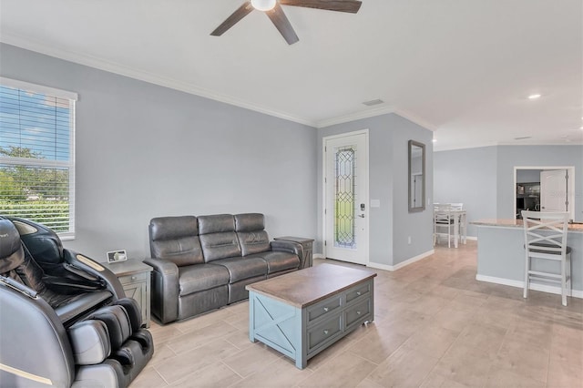 living room featuring ceiling fan and ornamental molding